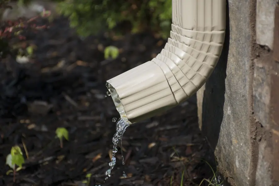 Downspout discharging rainwater away from a Houston home